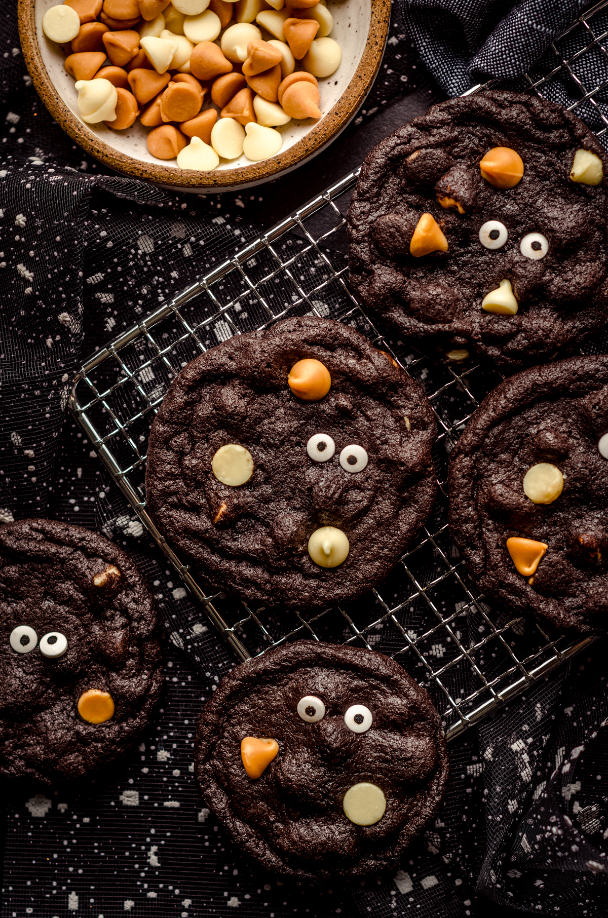 Chocolate Halloween cookies on a cooling rack.