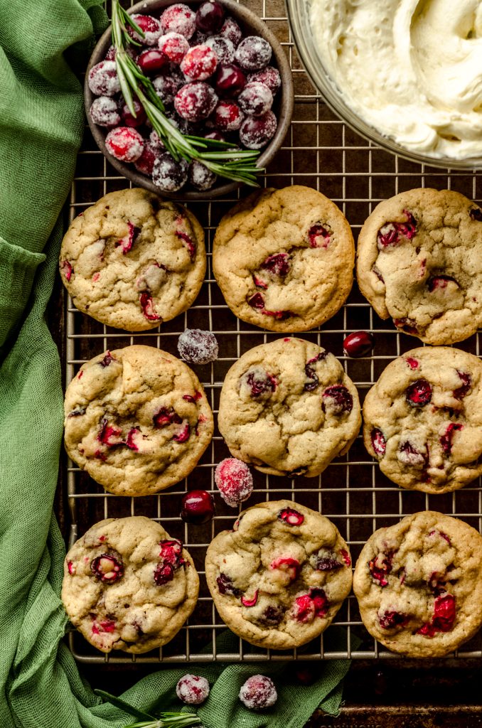 Fresh cranberry cookies on a wire cooling rack.
