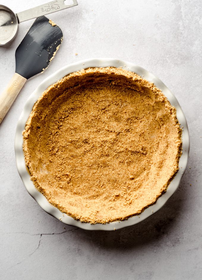 A graham cracker crust pressed into a pie plate.