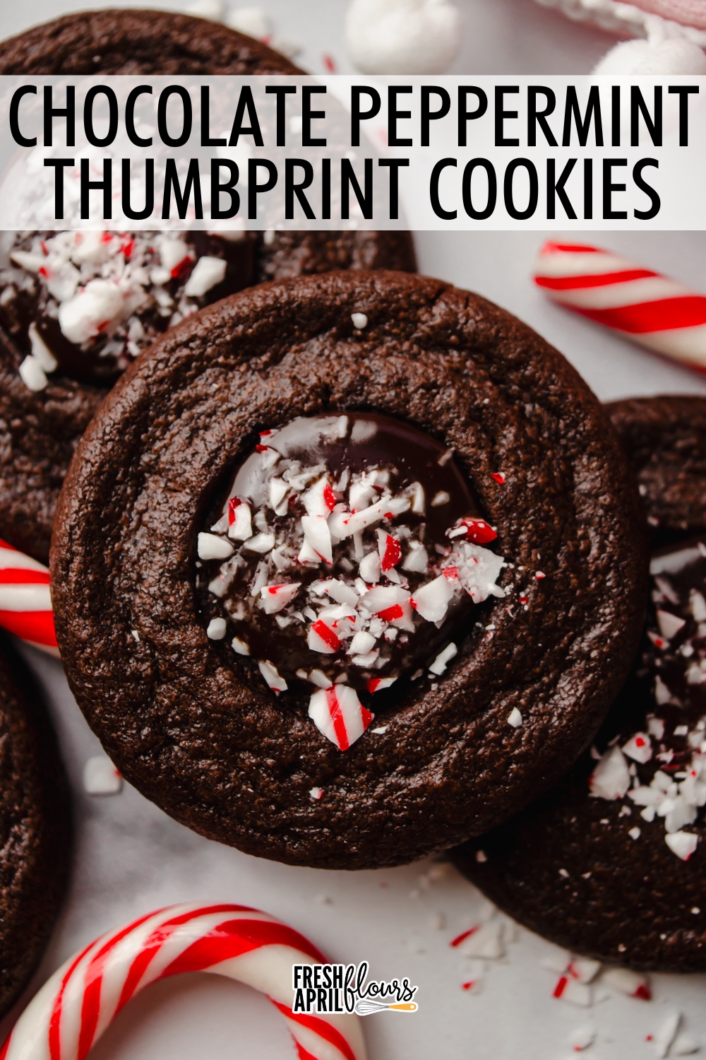 These chocolate peppermint thumbprints feature a thick and rich chocolate cookie filled with chocolate peppermint ganache and crushed candy canes for a festive looking and tasting cookie. via @frshaprilflours