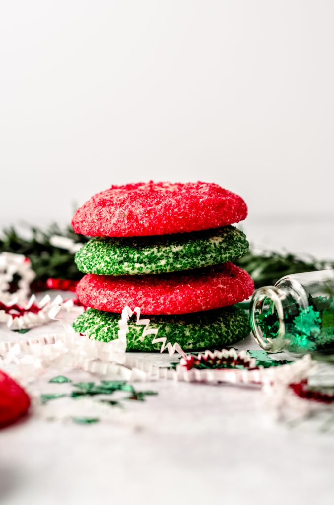 A stack of red and green Christmas sugar cookies.