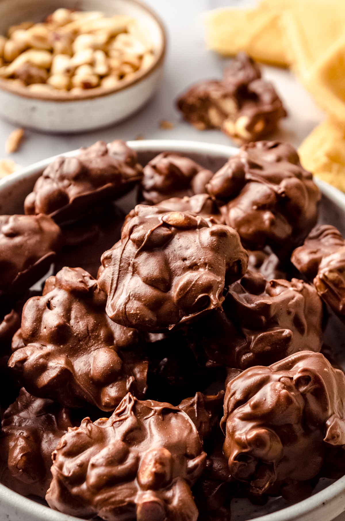 Slow cooker peanut clusters on a plate.