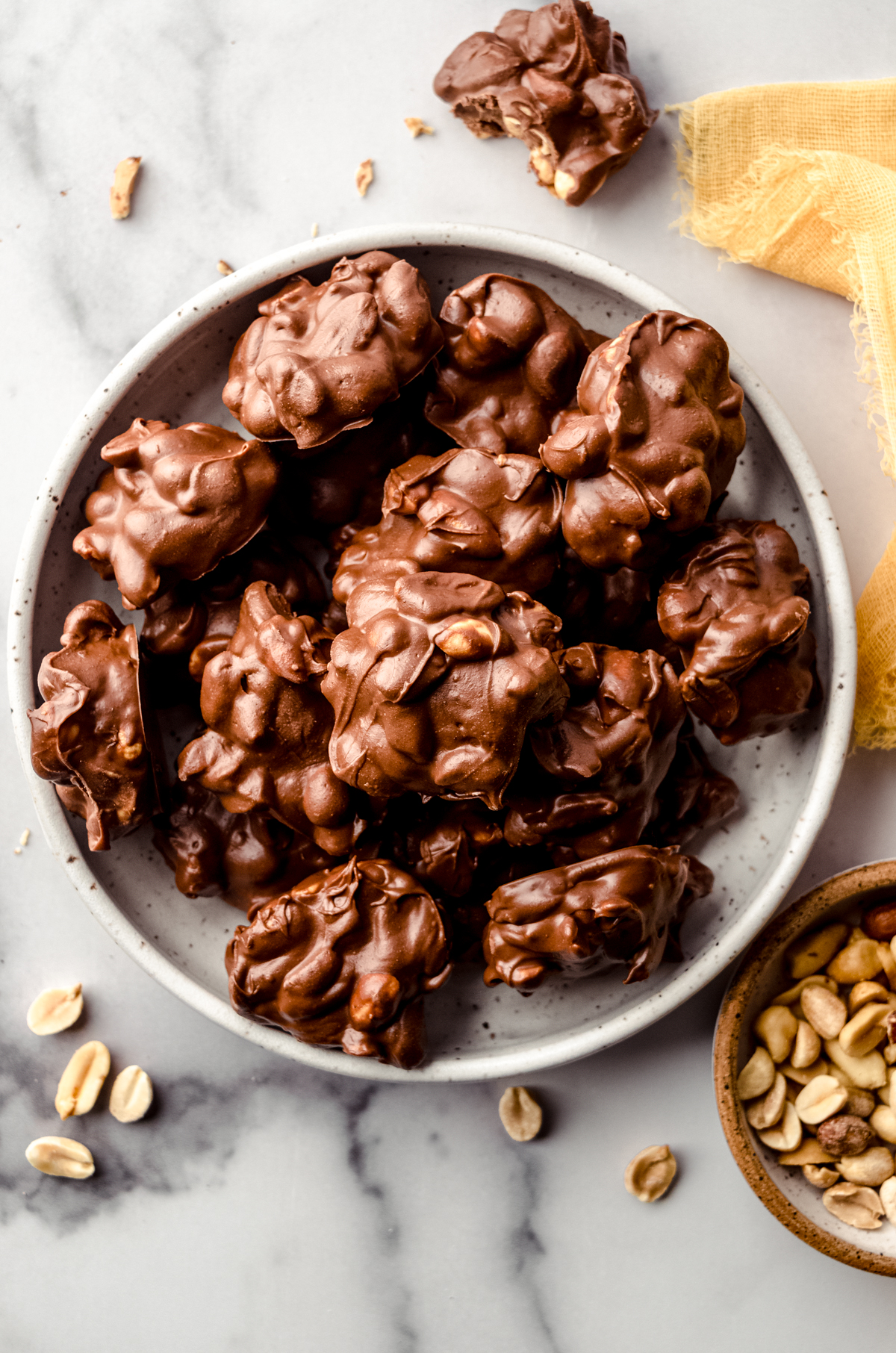 Aerial photo of slow cooker peanut clusters on a plate.