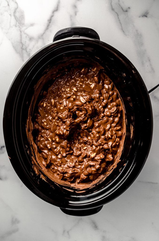 Aerial photo of peanut clusters mixture in a slow cooker.