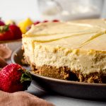Classic cheesecake on a serving platter.
