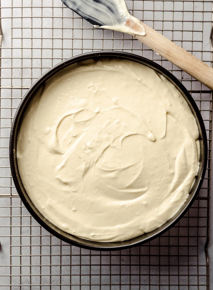 Classic cheesecake in a pan ready to bake.