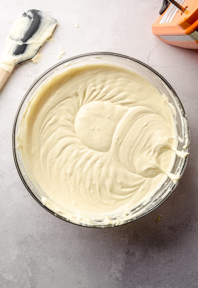 Classic cheesecake batter in a large glass bowl.