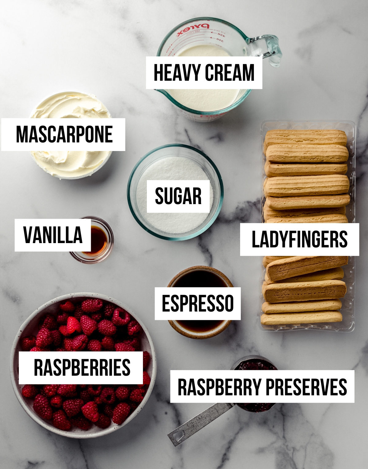 Aerial photo of ingredients for raspberry tiramisu with text overlay.
