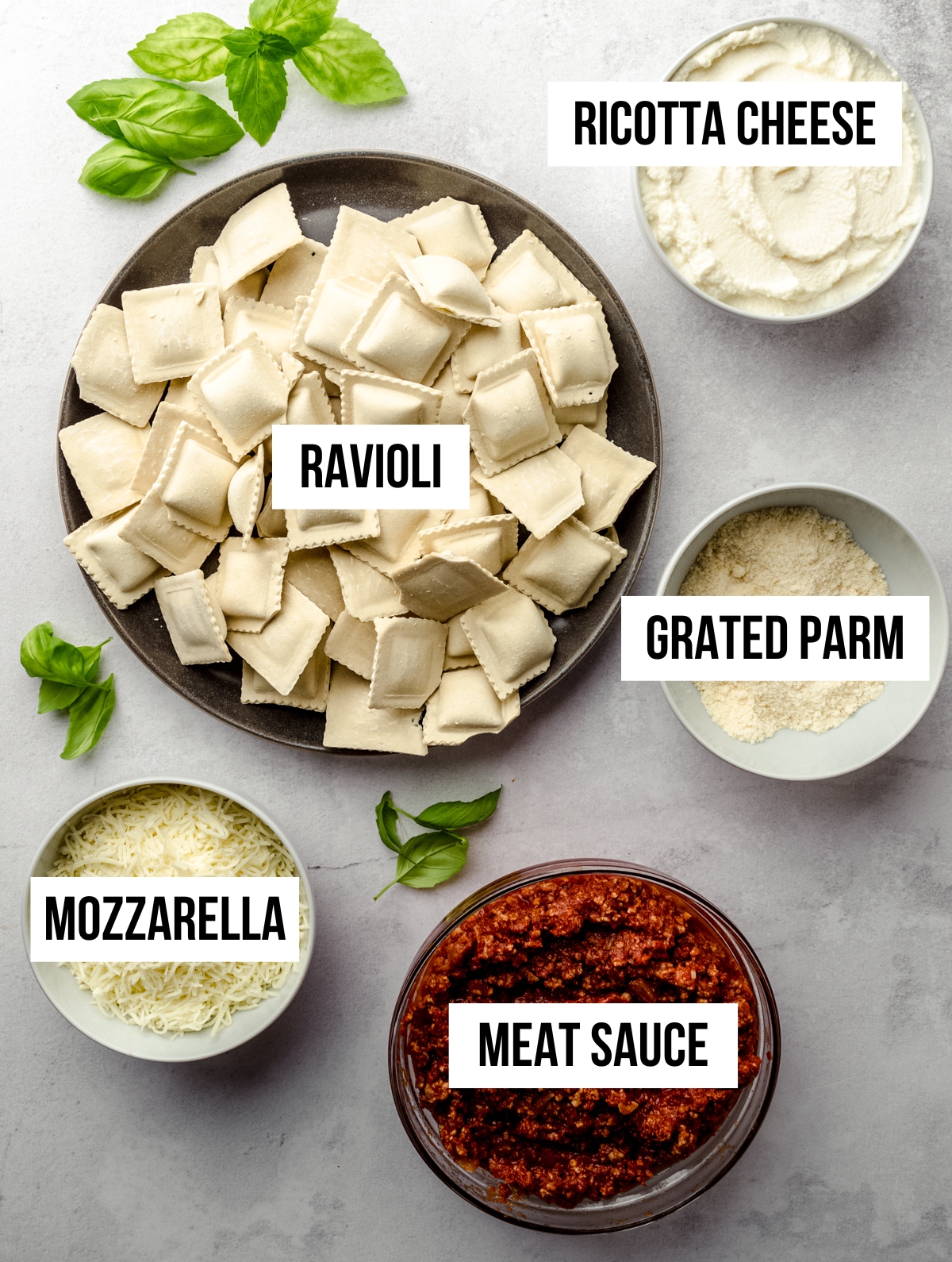 Aerial photo of ingredients to make ravioli lasagna with text overlay.