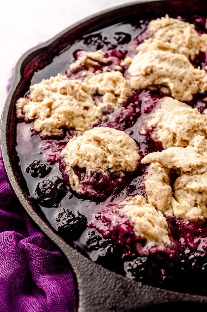Blackberry dumplings in a cast iron skillet ready to cook.