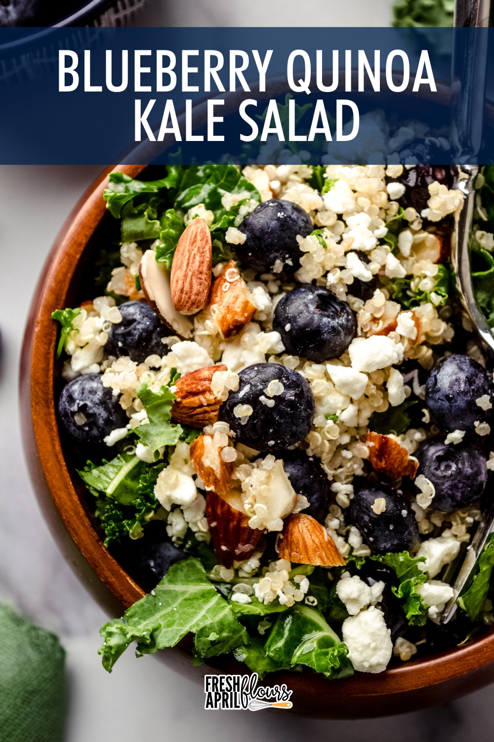 A bright and textured salad filled with juicy blueberries, crisp kale, tangy feta cheese, and crunchy almonds in a fresh lemon dressing. via @frshaprilflours