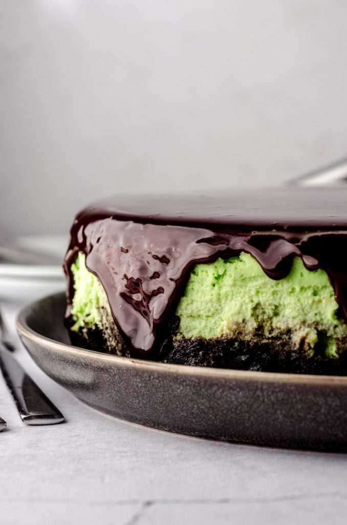 A mint chocolate cheesecake on a plate.