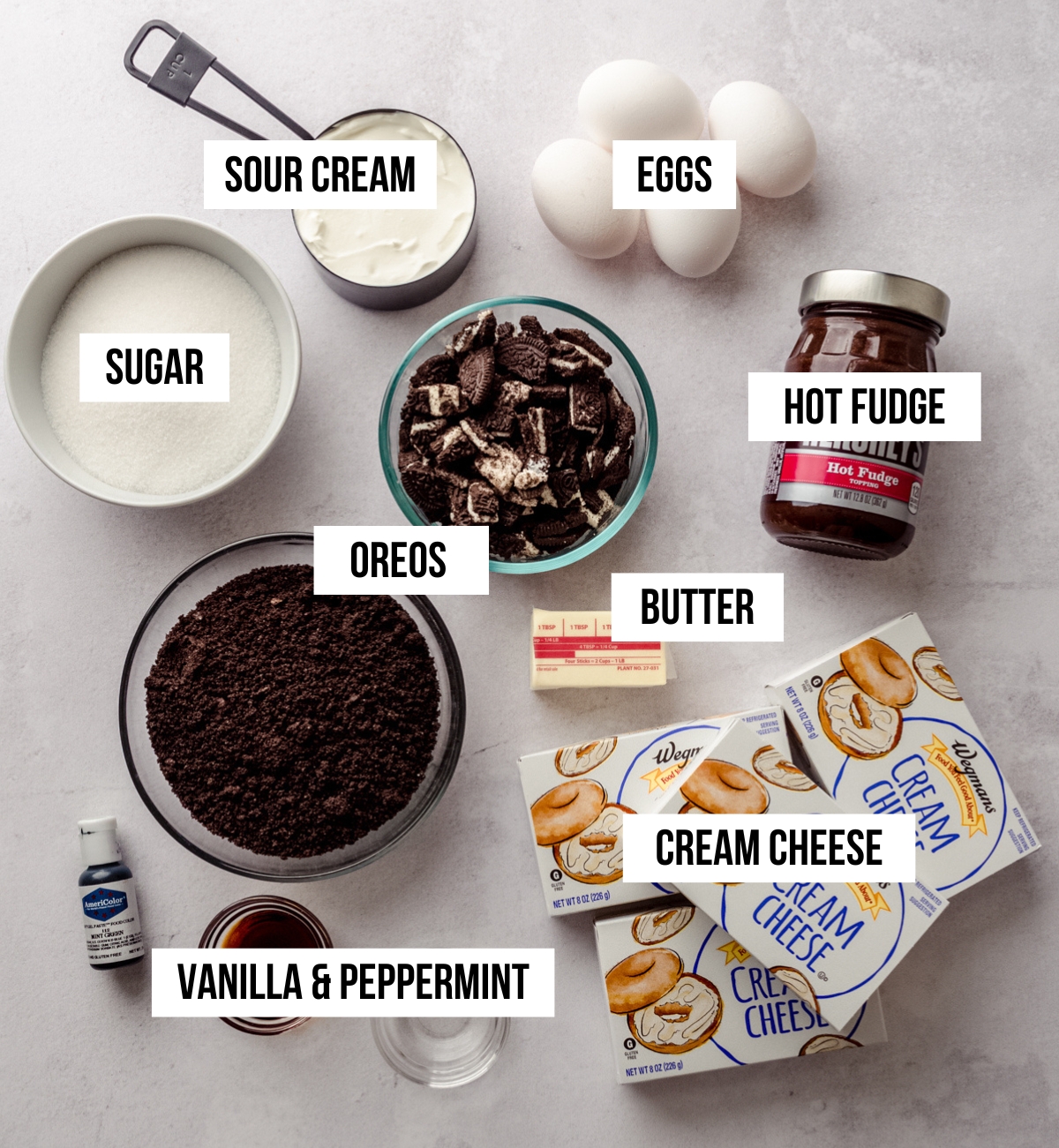 Aerial photo of ingredients for mint chocolate cheesecake with text overlay.