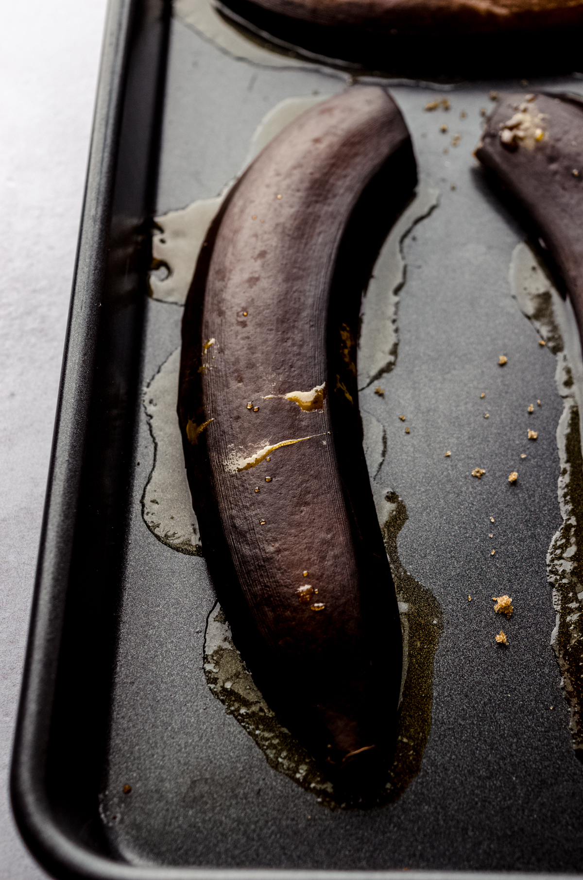 Baked bananas in the peel face down with sugary juices squishing out of the sides.