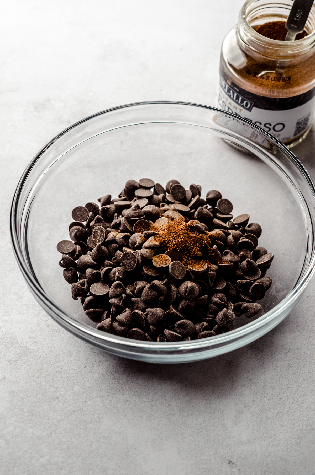 A bowl of chocolate chips and espresso powder to make chocolate espresso ganache.