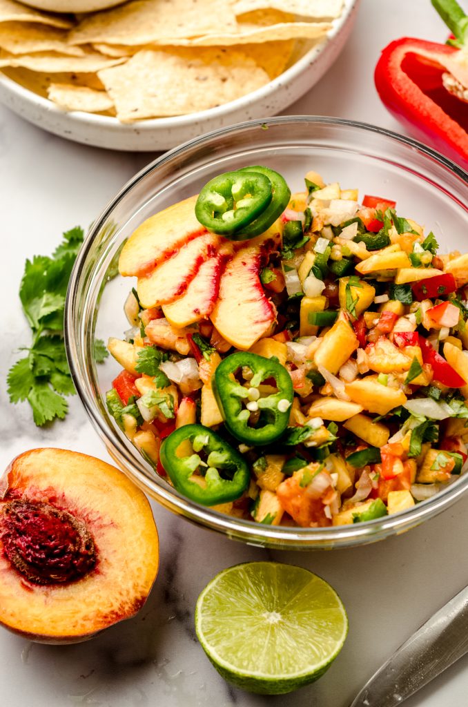 A bowl of peach salsa.