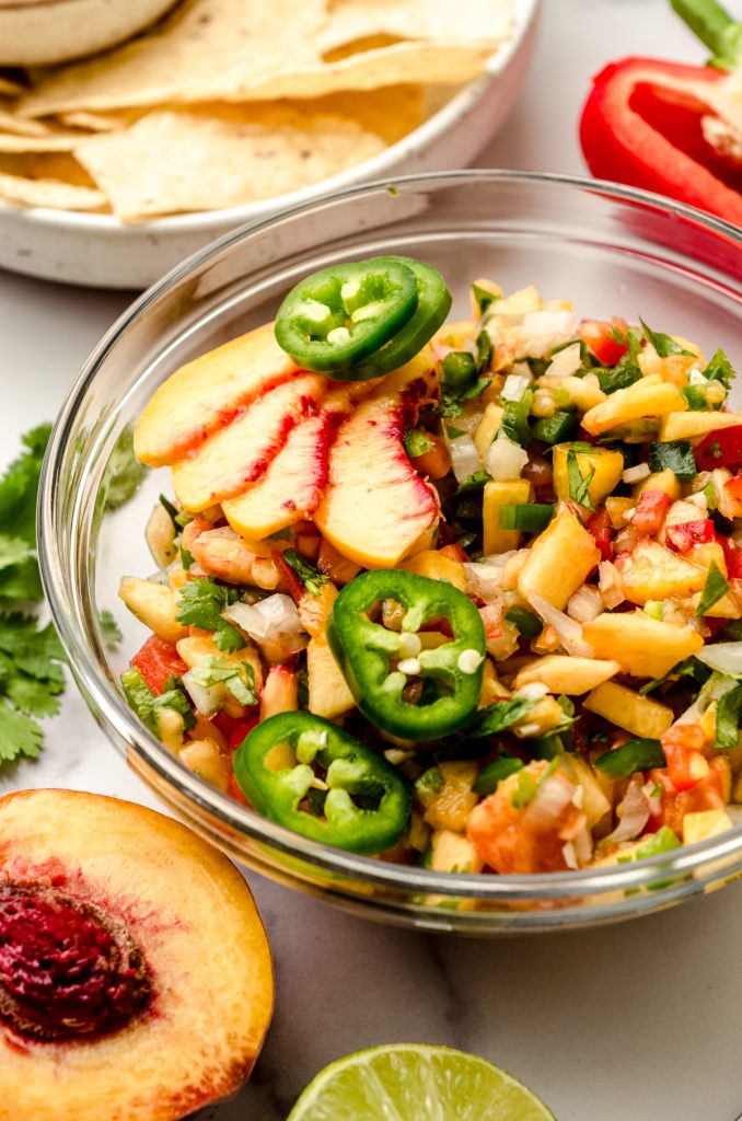 A bowl of peach salsa.