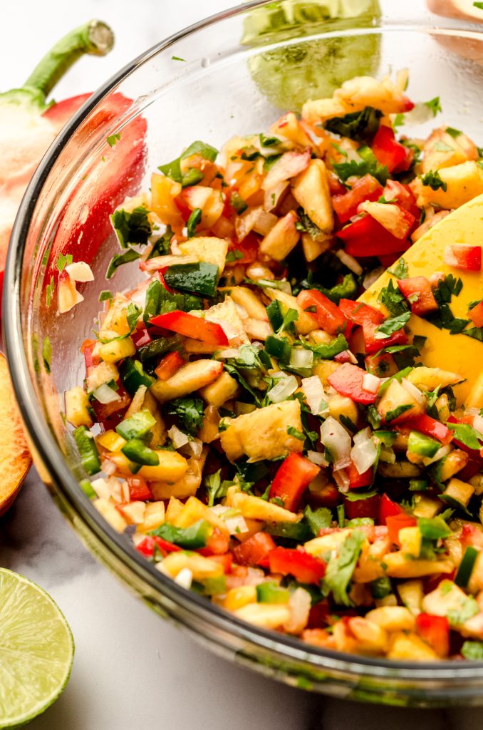 A bowl of fresh peach salsa.