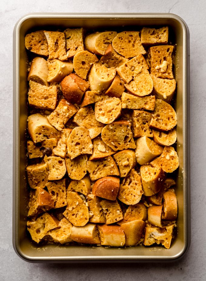 Aerial photo of a baking dish of pumpkin French toast casserole before adding a streusel topping.