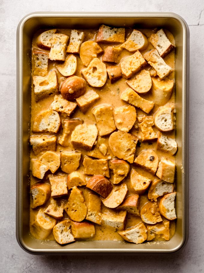 Aerial photo of a baking dish of pumpkin French toast casserole before adding a streusel topping.