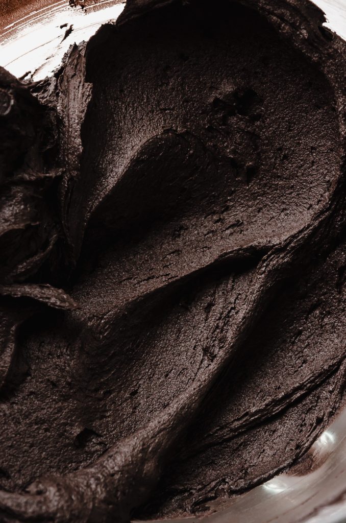 A closeup shot of black cocoa chocolate frosting.