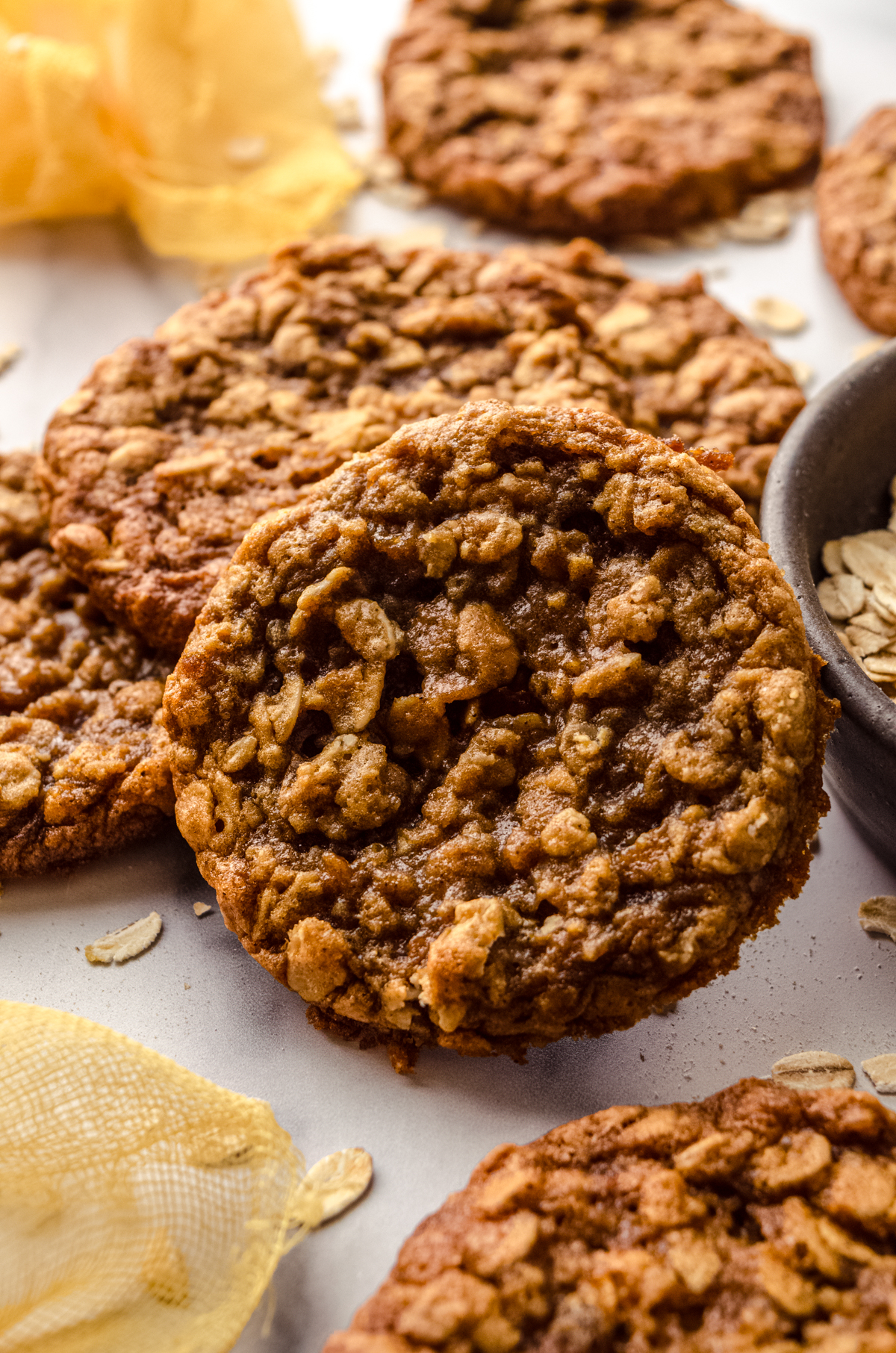 Chewy oatmeal cookies on a surface.