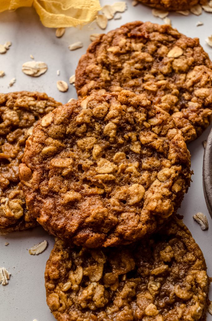 Chewy oatmeal cookies on a surface.