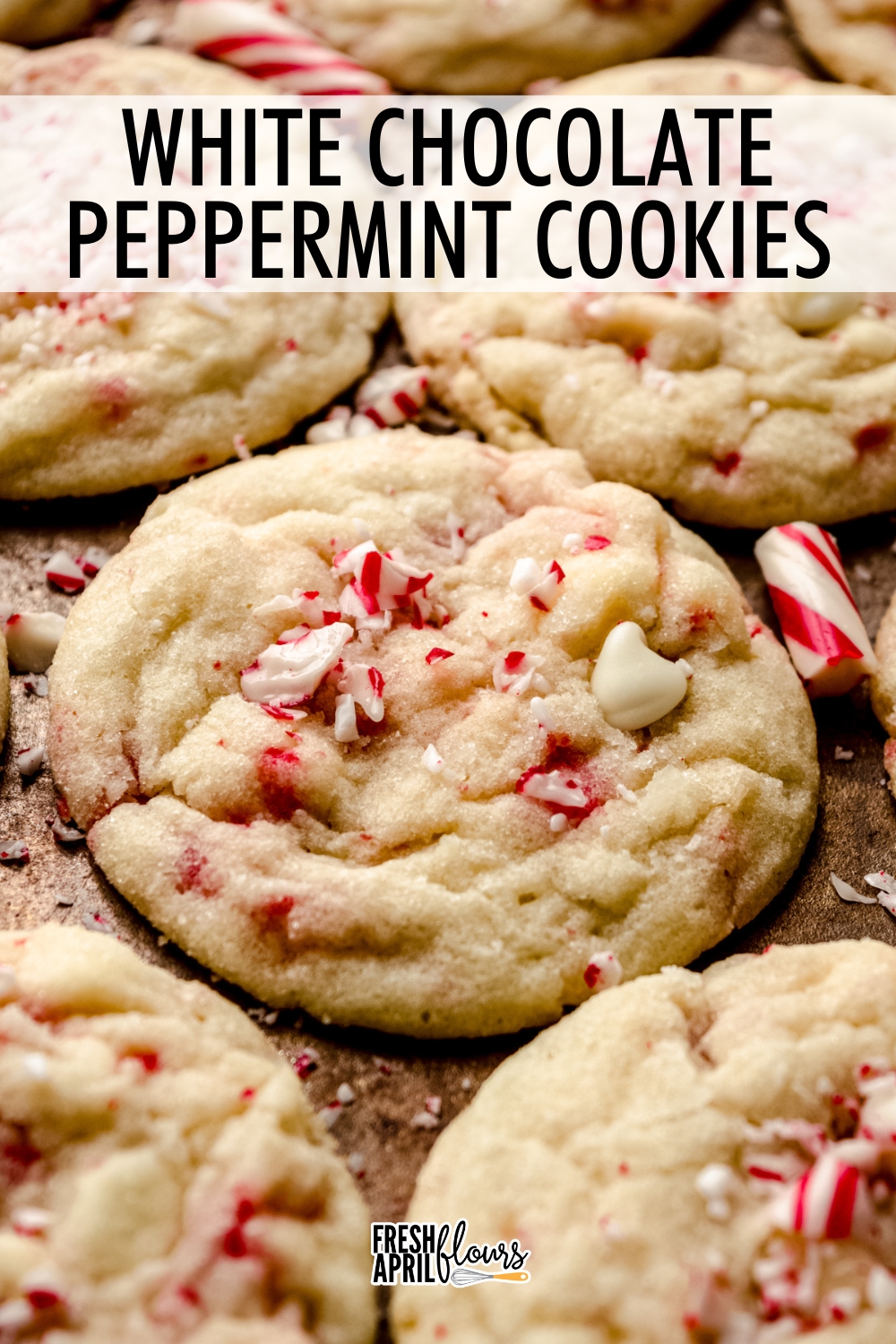 These soft and tender sugar cookies filled with creamy white chocolate chips and crunchy bits of candy canes absolutely melt in your mouth with every sugar-coated bite. They're the perfect festive holiday cookie! via @frshaprilflours