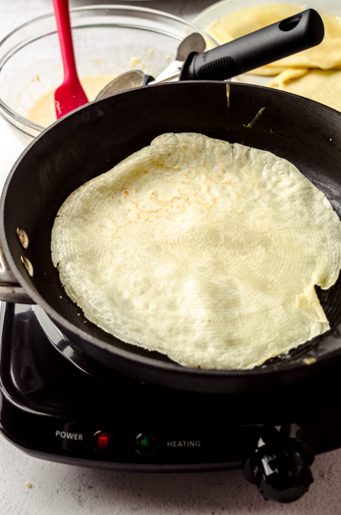 A homemade crepe in a skillet.