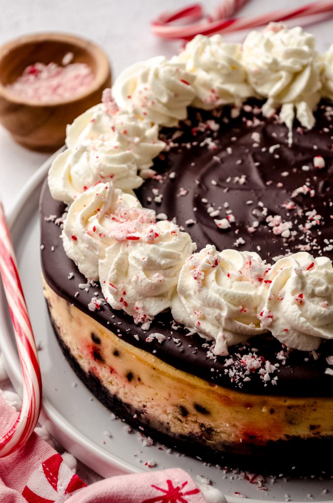 A peppermint bark cheesecake on a plate.