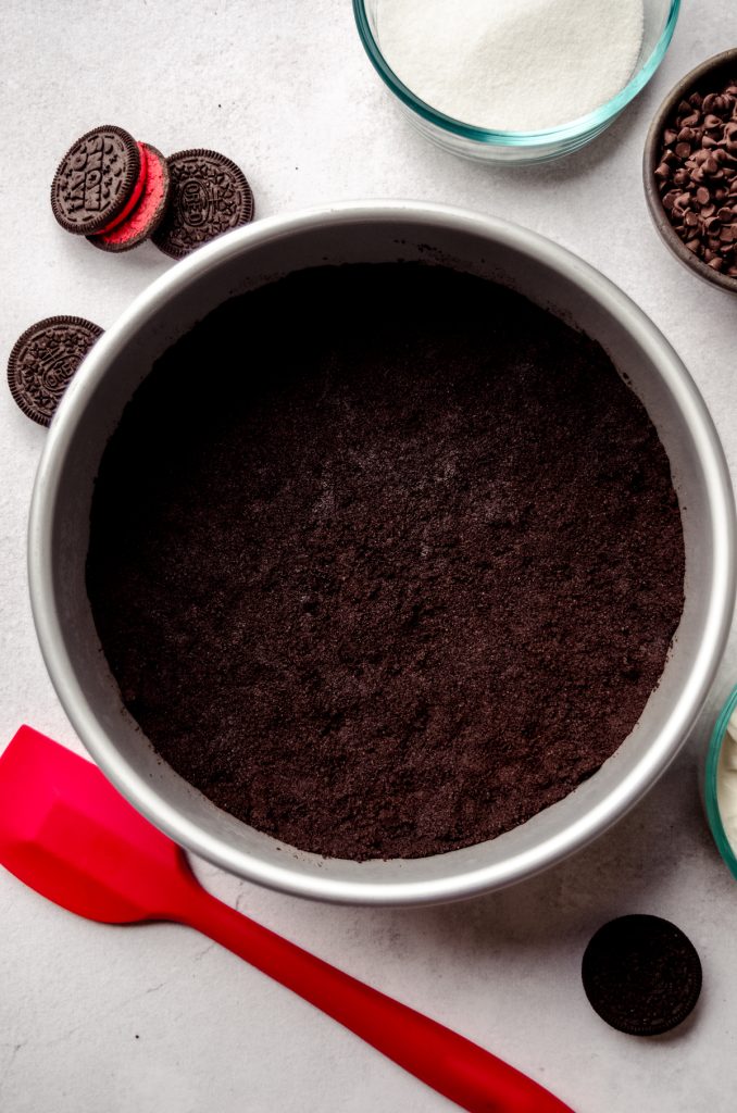 Aerial photo of a holiday Oreo crust in a cheesecake pan.