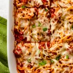 Aerial photo of a casserole of baked spaghetti that has been sliced.