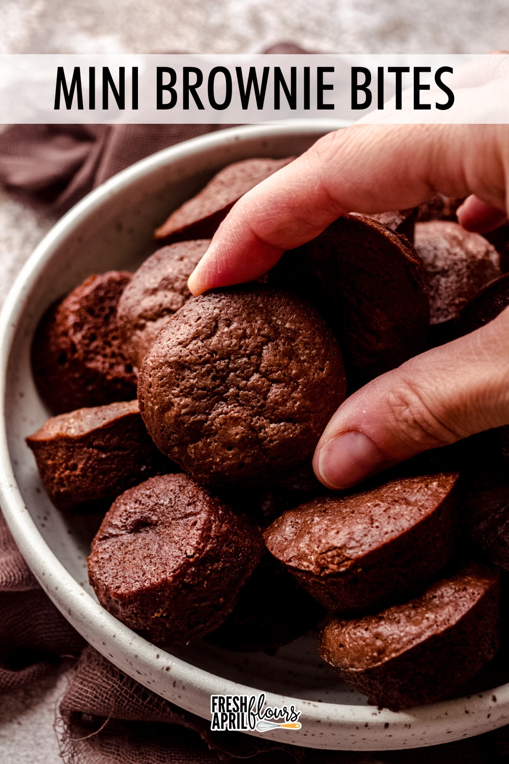 These chewy brownie bites deliver the same dense and fudgy indulgence as my original scratch brownies you know and love, made with melted chocolate and donning that perfectly crackly top. Snackable and versatile, they’re the ultimate treat to make you fall in love with brownies from scratch in two bites or less! via @frshaprilflours