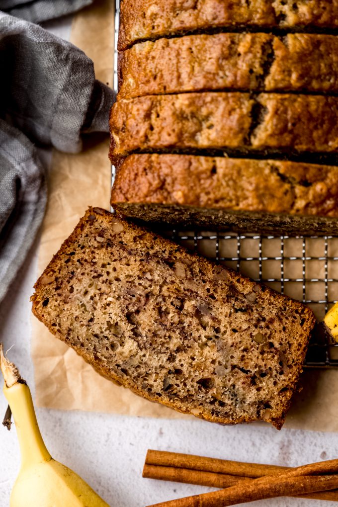 Aerial photo of a loaf of banana bread that has been sliced.