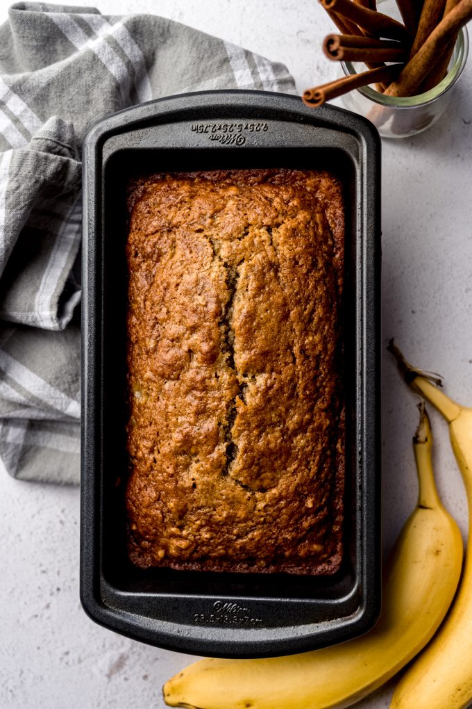 Aerial photo of banana bread baked in a loaf pan.