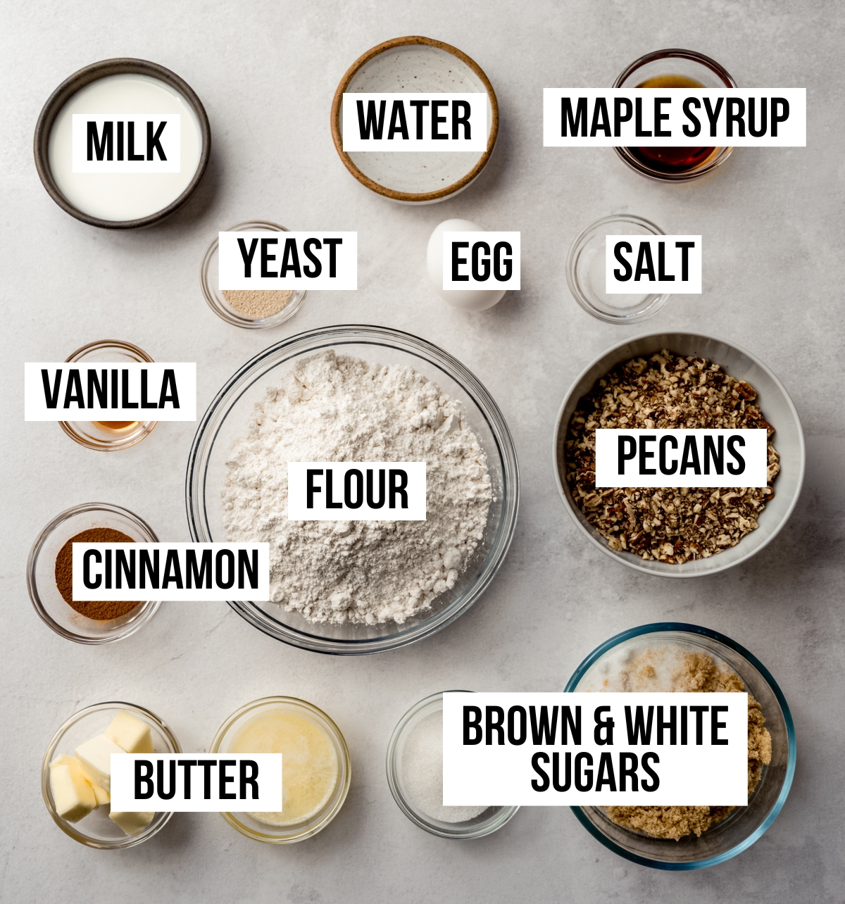 Aerial photo of ingredients to make sticky buns with text overlay labeling each ingredient.