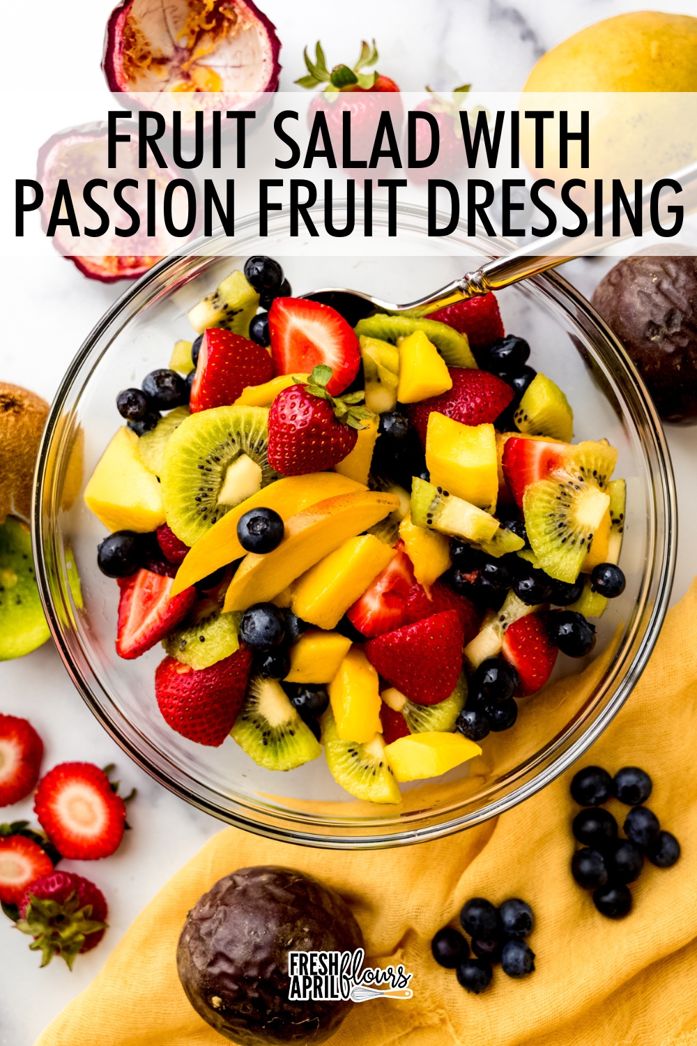 This vibrant and colorful fruit salad features mango, strawberries, kiwi, and blueberries with a tropical upgrade from a sweet and tangy passion fruit-lime dressing. It's perfect as a standalone side dish but also goes well on ice cream, with whipped cream, or on angel food cake or crepes. via @frshaprilflours
