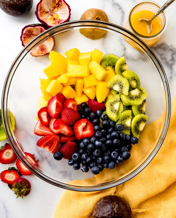 Aerial photo of cut fruit in a bowl to make fruit salad.