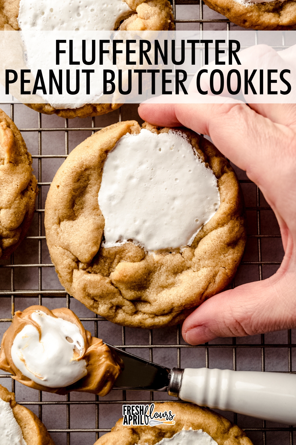 These bakery-style soft and chewy peanut butter cookies filled with puddles of melted, gooey marshmallow fluff have childhood nostalgia in every bite. via @frshaprilflours