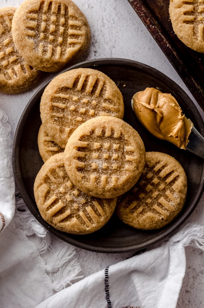 Aerial photo of classic peanut butter cookies on a plate.