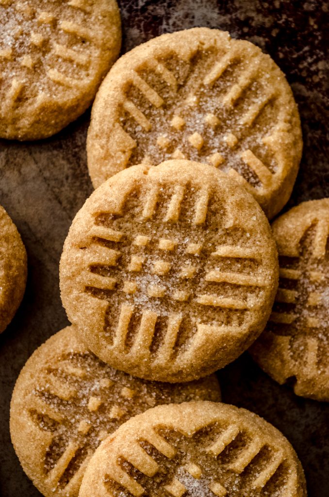 Aerial photo of classic peanut butter cookies on a surface.