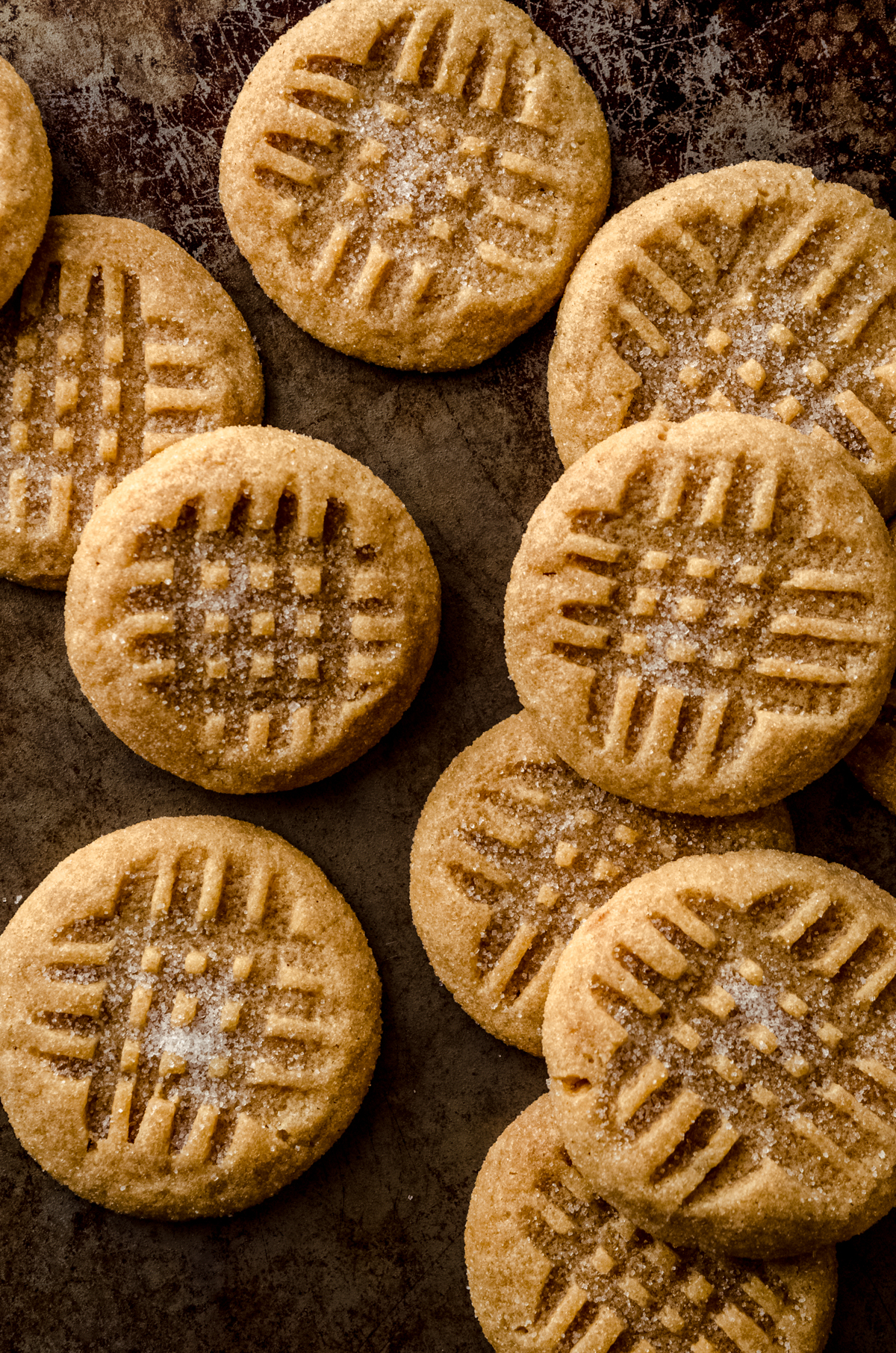 Aerial photo of classic peanut butter cookies on a surface.