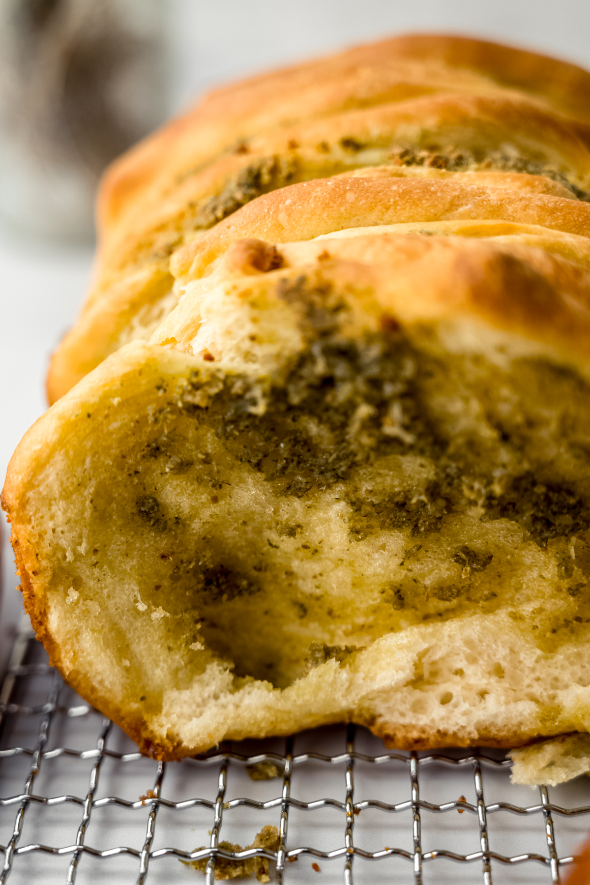 A loaf of pesto pull-apart bread on a surface.