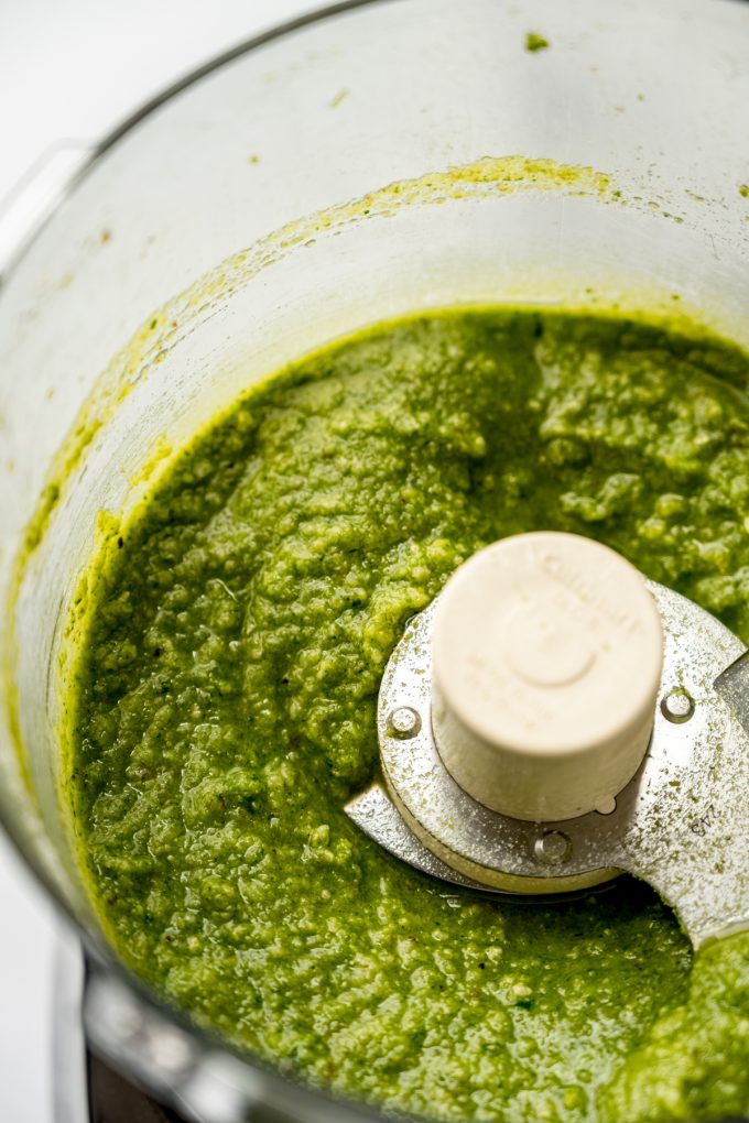 Homemade pesto in the drum of a food processor.
