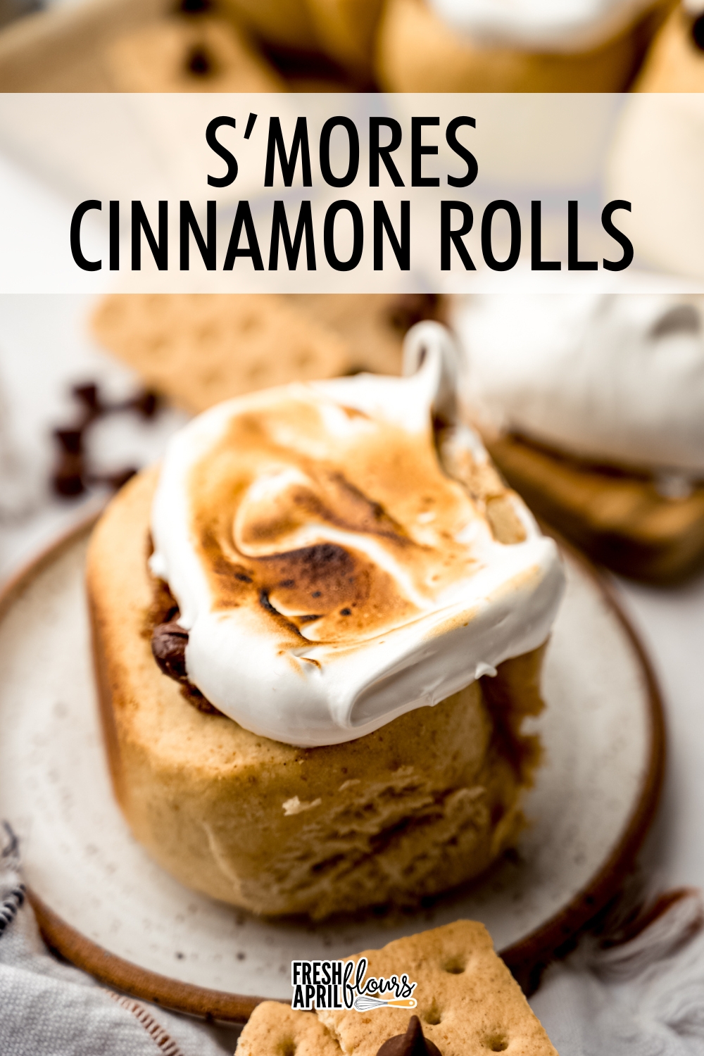 These soft and fluffy s’mores cinnamon rolls start with a graham cracker-infused dough, are filled with cinnamon and chocolate, and finished with an easy marshmallow meringue topping. via @frshaprilflours