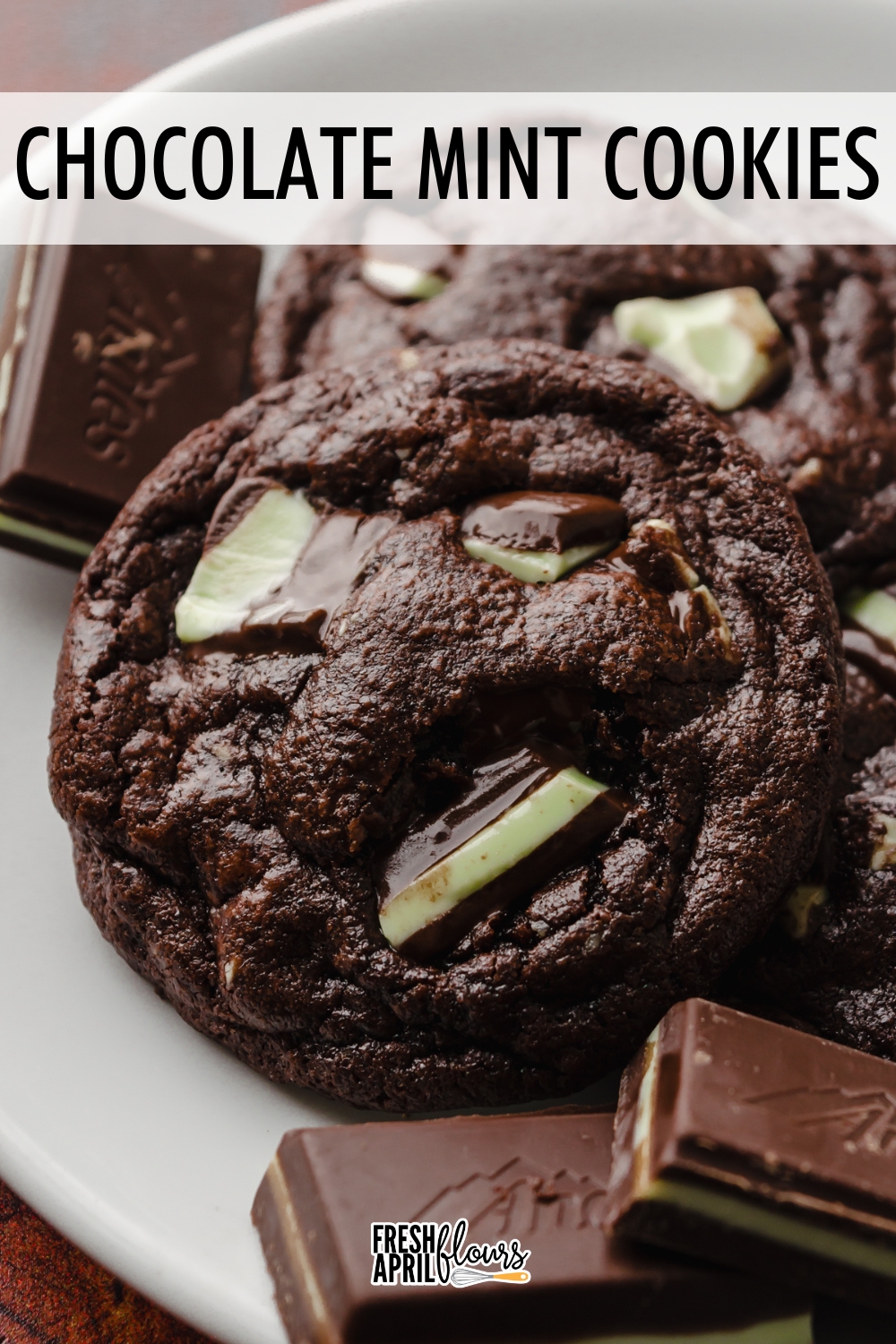 These ultra fudgy and chewy chocolate cookies are filled with cool and creamy mint chocolate pieces in every bite. via @frshaprilflours