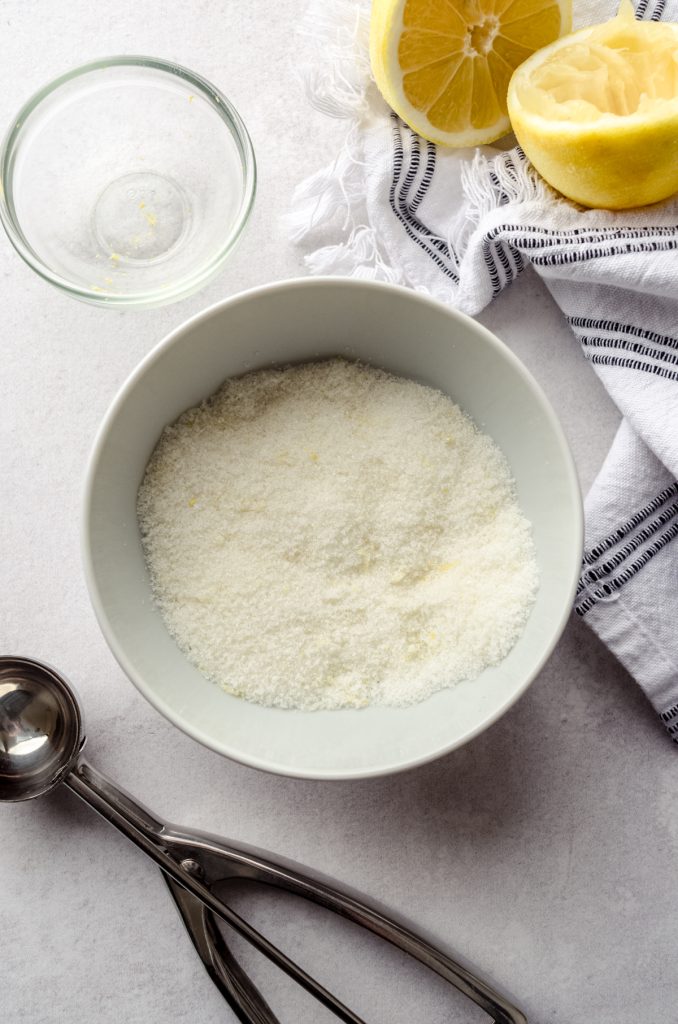 An aerial photo of a bowl of lemon sugar for the coating on lemon sugar cookies.