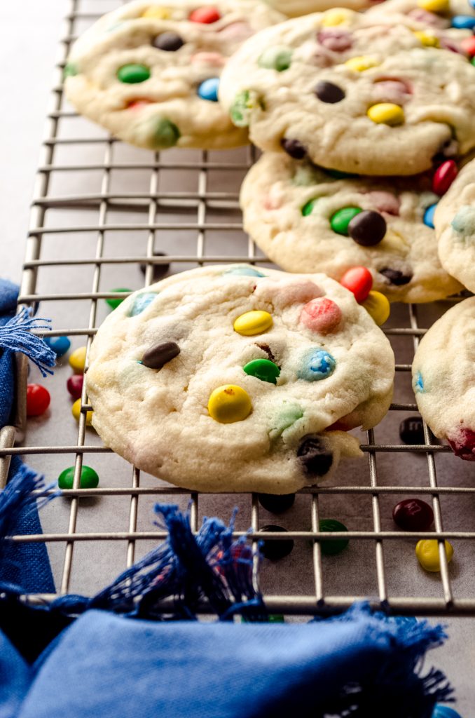 M&M cookies on a cooling rack.