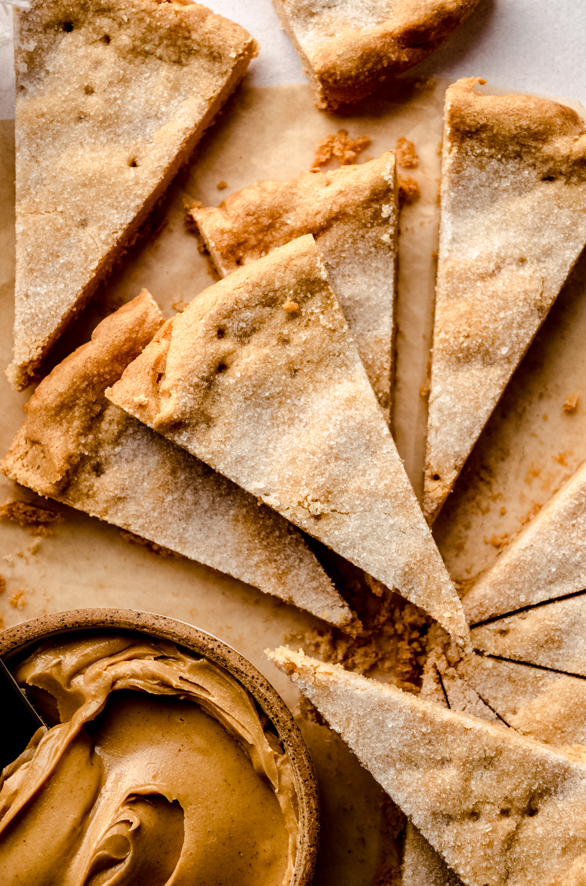 Aerial photo of peanut butter shortbread slices on a surface.