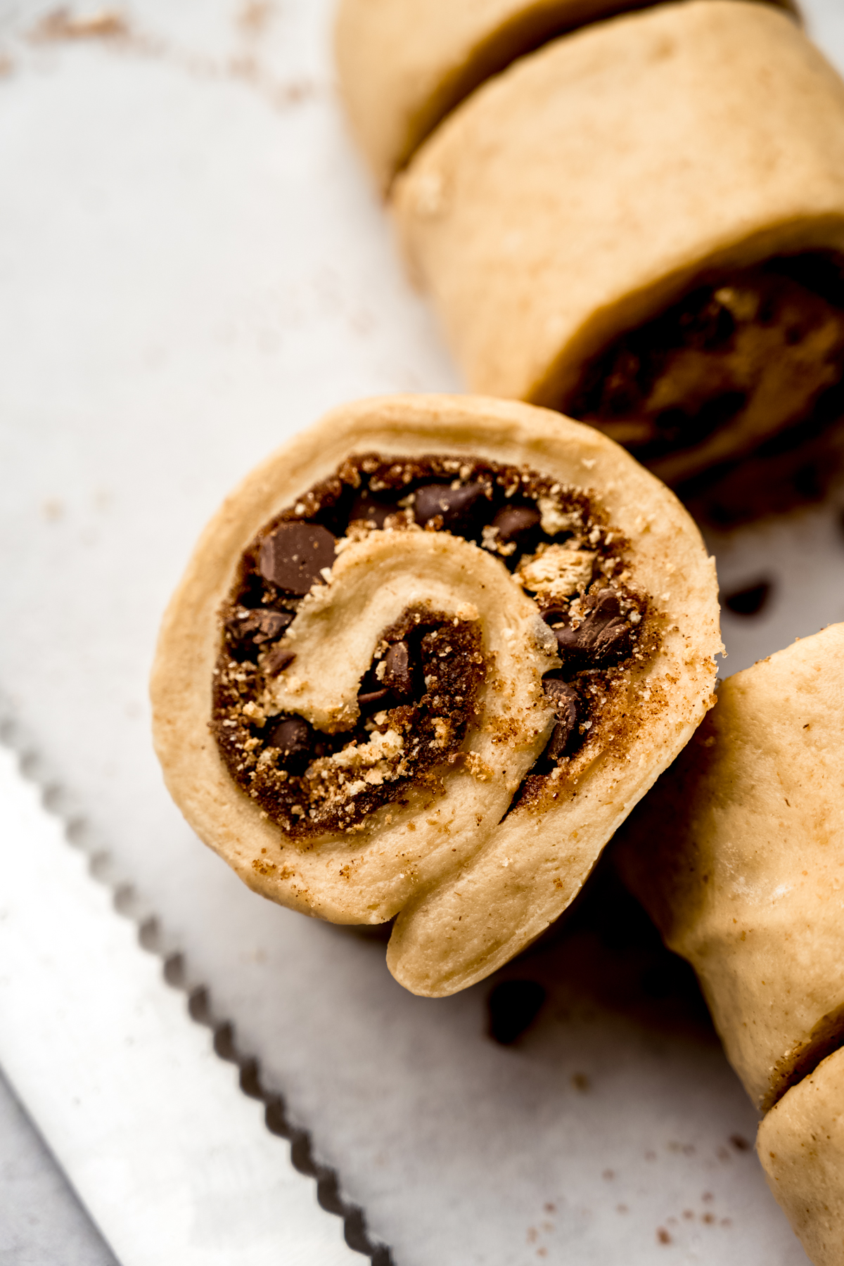 S'mores cinnamon roll dough sliced into individual rolls.